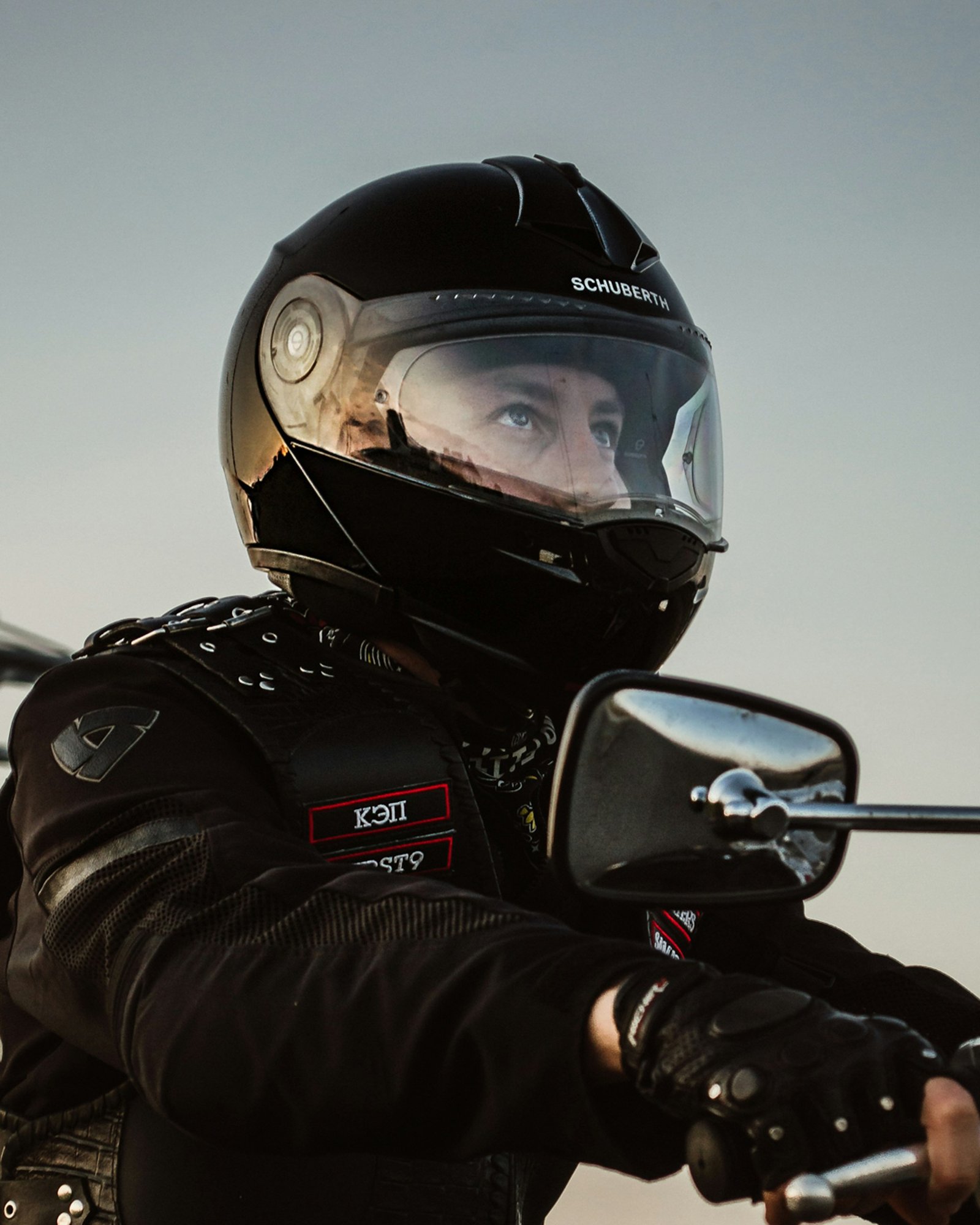 Rider in black helmet on motorcycle